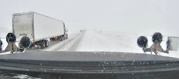 Photo: Blizzard conditions from a snowplow camera near Fargo.